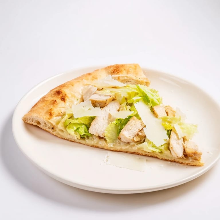 Close-up of a delicious Chicken Caesar Flatbread with fresh romaine, Caesar dressing, and sliced grilled chicken on a rustic board.