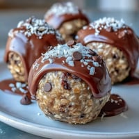 Wholesome no-bake oat bites with peanut butter and chocolate chips, perfect for quick energy on the go.